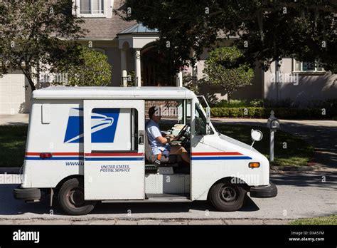 Postal Delivery Van with USPS Mail Carrier, USA Stock Photo - Alamy