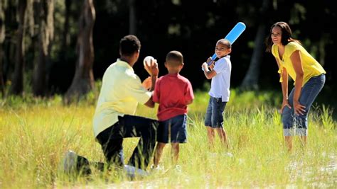 Healthy Young Ethnic Family Having Fun Playing Baseball Together In The Park Stock Footage Video ...