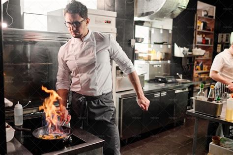 Chef Cooking Flambe Style In Kitchen - Stock Photos | Motion Array