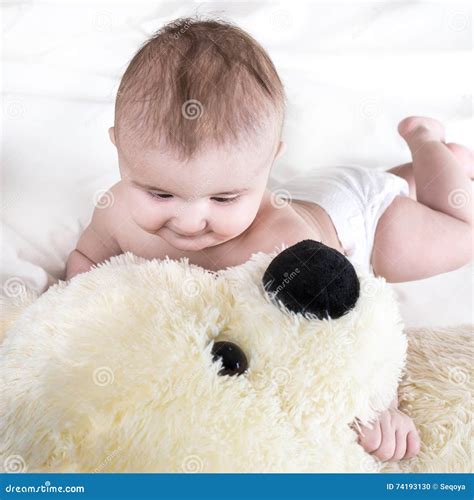 The Baby is Playing with Bear Stock Photo - Image of newborn, cute: 74193130