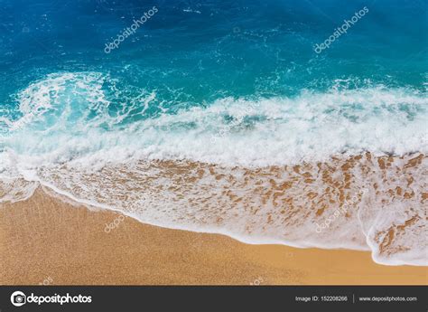 Blue wave on the beach Stock Photo by ©kamchatka 152208266