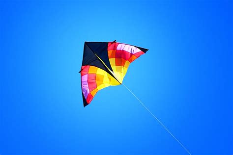 Kite Flying High In Blue Sky Photograph by Tracie Kaska