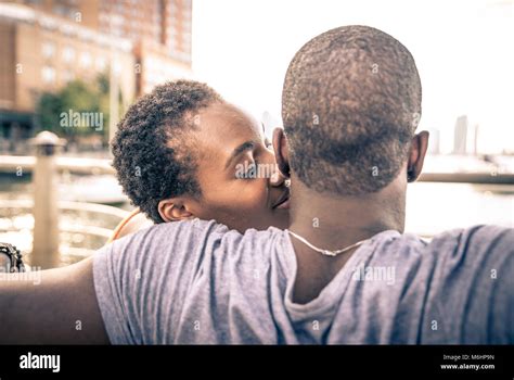 African american couple enjoying sunset Stock Photo - Alamy