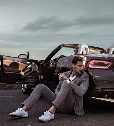 Elegant Man Leaning on the Luxurious Car Stock Photo - Image of rocks ...