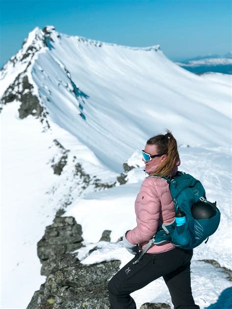 Photo of Woman On Top Of Snow Capped Mountain · Free Stock Photo