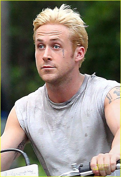 Ryan Gosling shows his wild side with bleach blond hair and tattoos ...