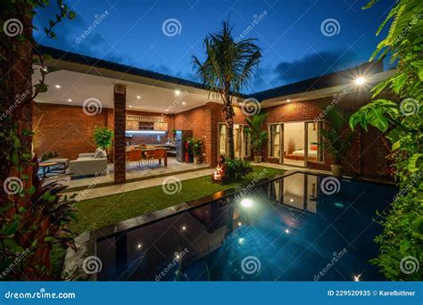 Modern New Luxurious Mansion Exterior with Swimming Pool and Colorful Sky at Dusk Editorial ...