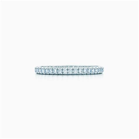 Tiffany Novo® emerald-cut engagement ring with a pavé diamond band in platinum. | Tiffany & Co.