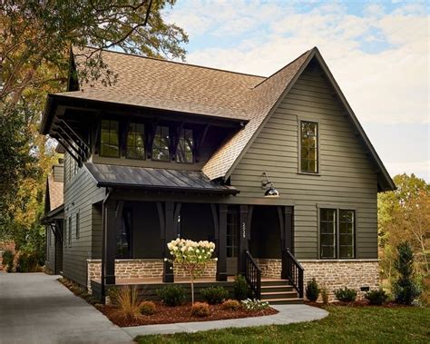 This stunning modern farmhouse, painted in Benjamin Moore Deep River ...