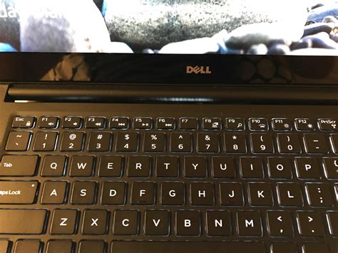 XPS 9560 - Keyboard backlighting leaking onto frame, is this normal? (see light below Dell logo ...