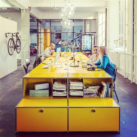 TEAM SPIRIT - Get together at one large desk. #goldenyellow #workplace #workspace #worktogether ...