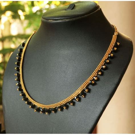 Gold plated chain with black beads. This is a handmade necklace with 6 ...