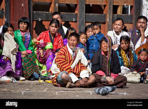 Bhutanese people in traditional clothes attending the annual festival ...