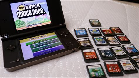 Nintendo DSi XL with original games, charger and case - YouTube