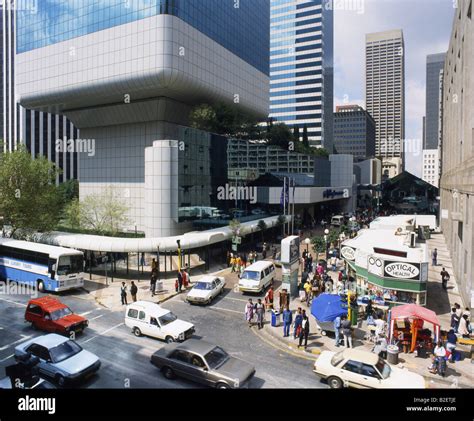 Pedestrians and traffic amidst high rise buildings at Small Street ...