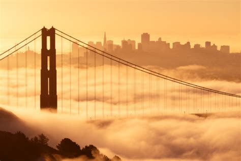 A Dramatic View Of The Golden Gate Bridge Covered In Fog Stock Photo - Download Image Now - iStock