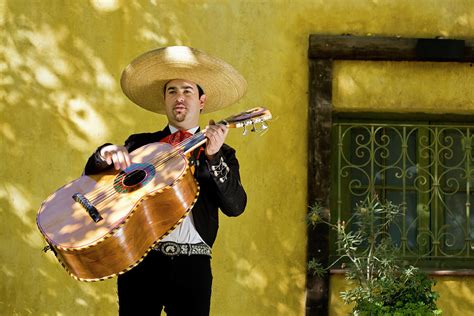 Mariachi Playing Guitar by Cristianl