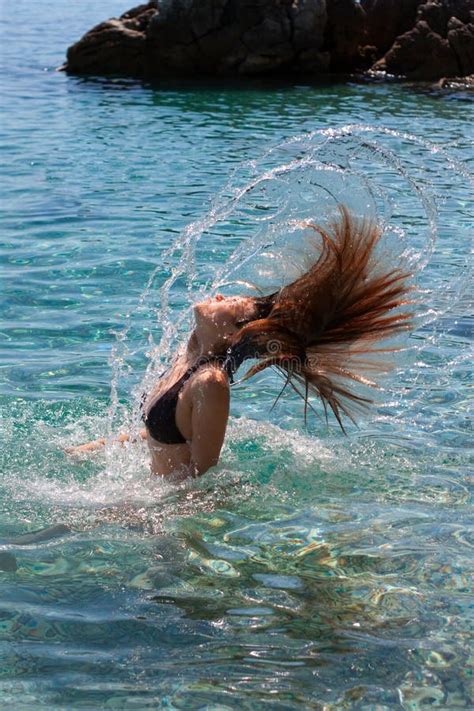 Girl making water splash stock photo. Image of female - 15634704