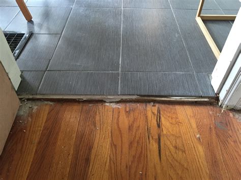 flooring - How do I transition from a wood floor to tile that has a 1-1 ...