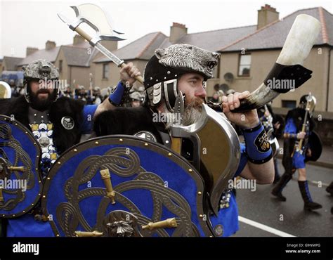 Shetland fire festival. The Jarl Squad march through the streets of ...