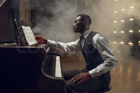 Ebony pianist, jazz performer on the stage | Stock image | Colourbox