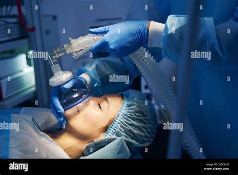 Anesthesia mask placed on the face of female patient Stock Photo - Alamy