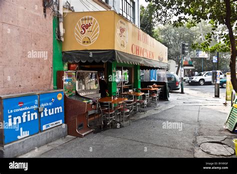 old fashioned outdoor seating at Mexican chicken restaurant with ...