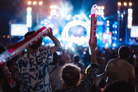 Crowd of Hands Up Concert Stage Lights and People Fan Audience Silhouette Raising Hands in the ...