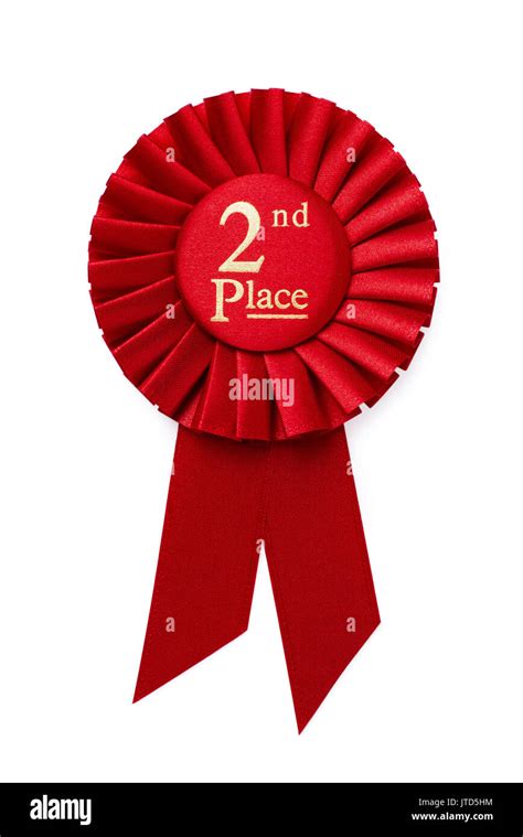 Red 2nd place ribbon rosette with gold central text in a pleated ...