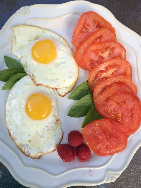 Organic cage free eggs, organic tomato, organic raspberries and organic home grown basil