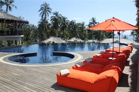Black Outdoor Lounge Chair in Between Blue Swimming Pool Under White Cloudy Blue Sky · Free ...
