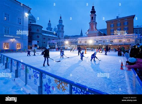 People playing hockey on an ice rink at the Mozartplatz, Salzburg, Austria Stock Photo - Alamy