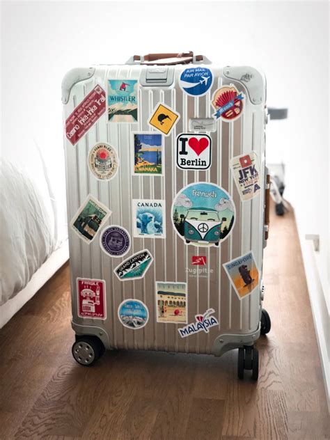 Download Rimowa Suitcase With Stickers Wallpaper | Wallpapers.com