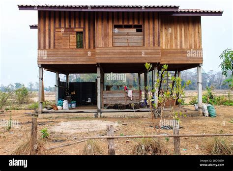 Traditional house on stilts in Laos Stock Photo - Alamy