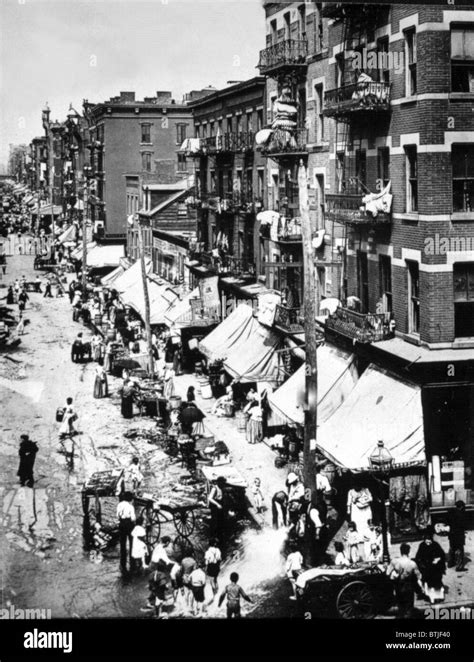 NEW YORK CITY, Immigrants on the summer streets of the Lower East Side, early 1900's Stock Photo ...