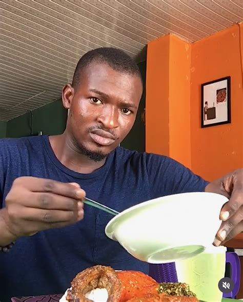 Rice served with egusi soup, topped with stew, fried hake fish, and ponmo - AfricanFoodies.com