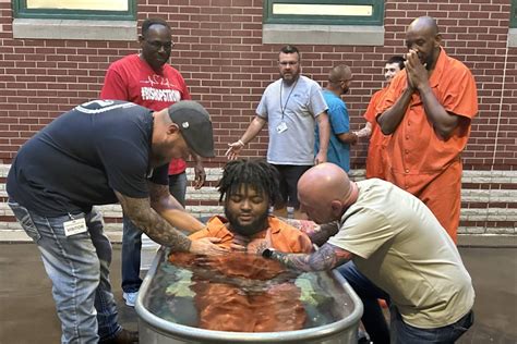 Local volunteers baptize 34 inmates at Christian County Jail ...