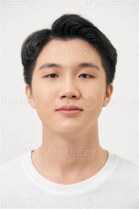 Happy smiling young handsome Asian man face on white background ...