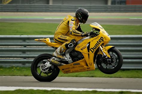 Person Riding on Yellow Sports Bike · Free Stock Photo