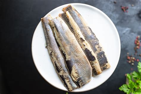 Premium Photo | Whole herring fresh fish or salted seafood ready to ...