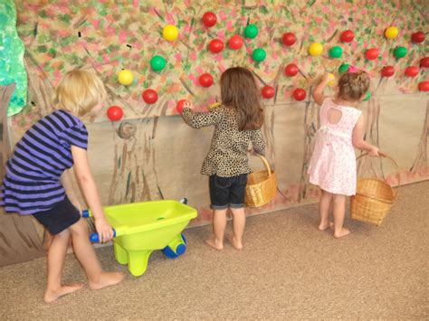 Interactive apple picking wall for dramatic play. Make a tree mural, add velcro to wall and to ...