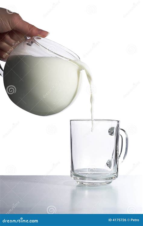 Milk Pouring Into Empty Glass Cup Royalty Free Stock Image - Image: 4175726