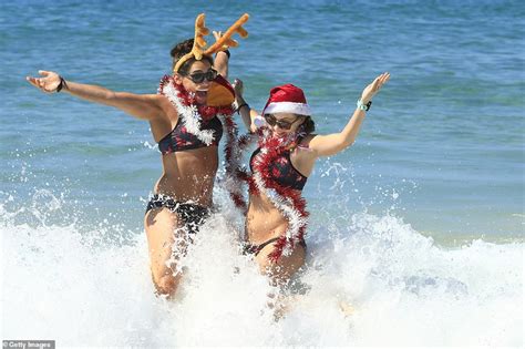 Thousands dressed in festive beach outfits flock to Bondi Beach and ...