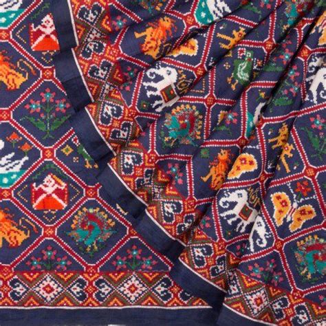 The navy blue Patan patola silk weave with several motifs within criss ...
