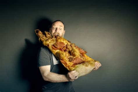 Man eating large pizza slice HD wallpaper | Wallpaper Flare