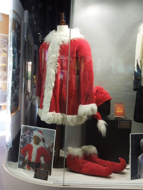 The Grinch's Santa suit and camera prop on display... | Hollywood Movie ...