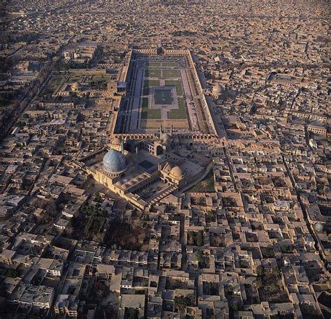 an aerial view of a large city with lots of buildings and trees in the ...