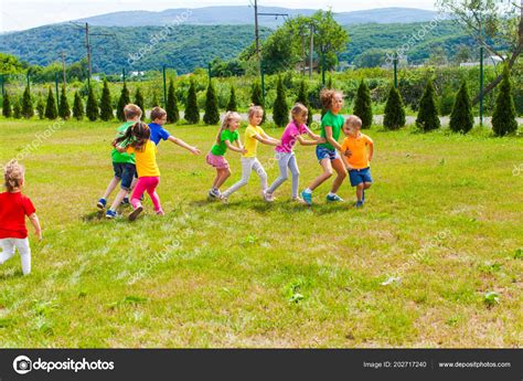 Children summer camp outdoor games Stock Photo by ©oksixx 202717240