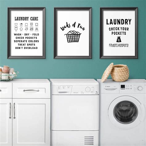 a laundry room with washer and dryer next to each other on the wall