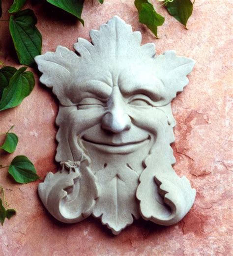 Display our Smiling Green Man Face Cast Stone Wall Art indoors or out and enjoy his friendly ...